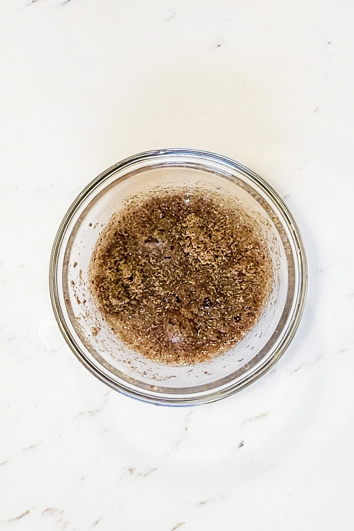 Ground flaxseed and water in a bowl.