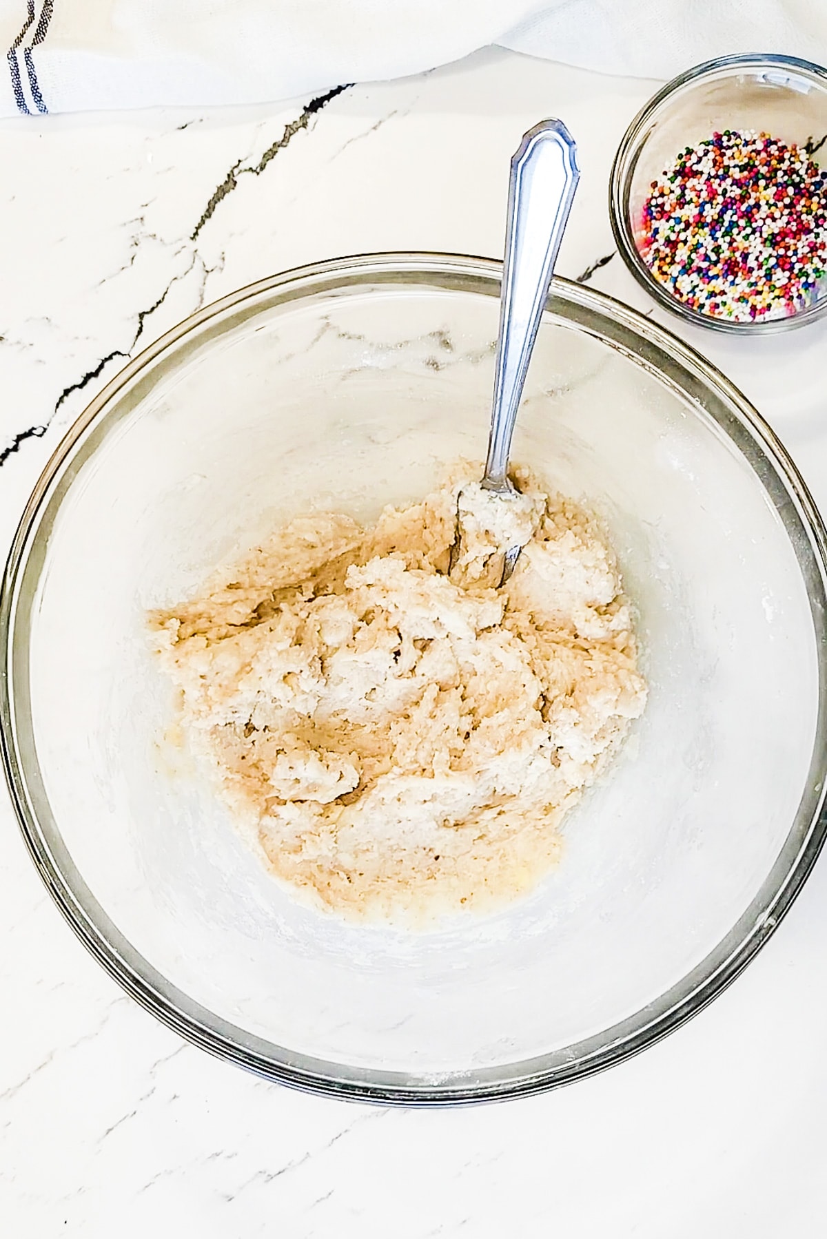 Funfetti sugar cookies batter in a bowl.