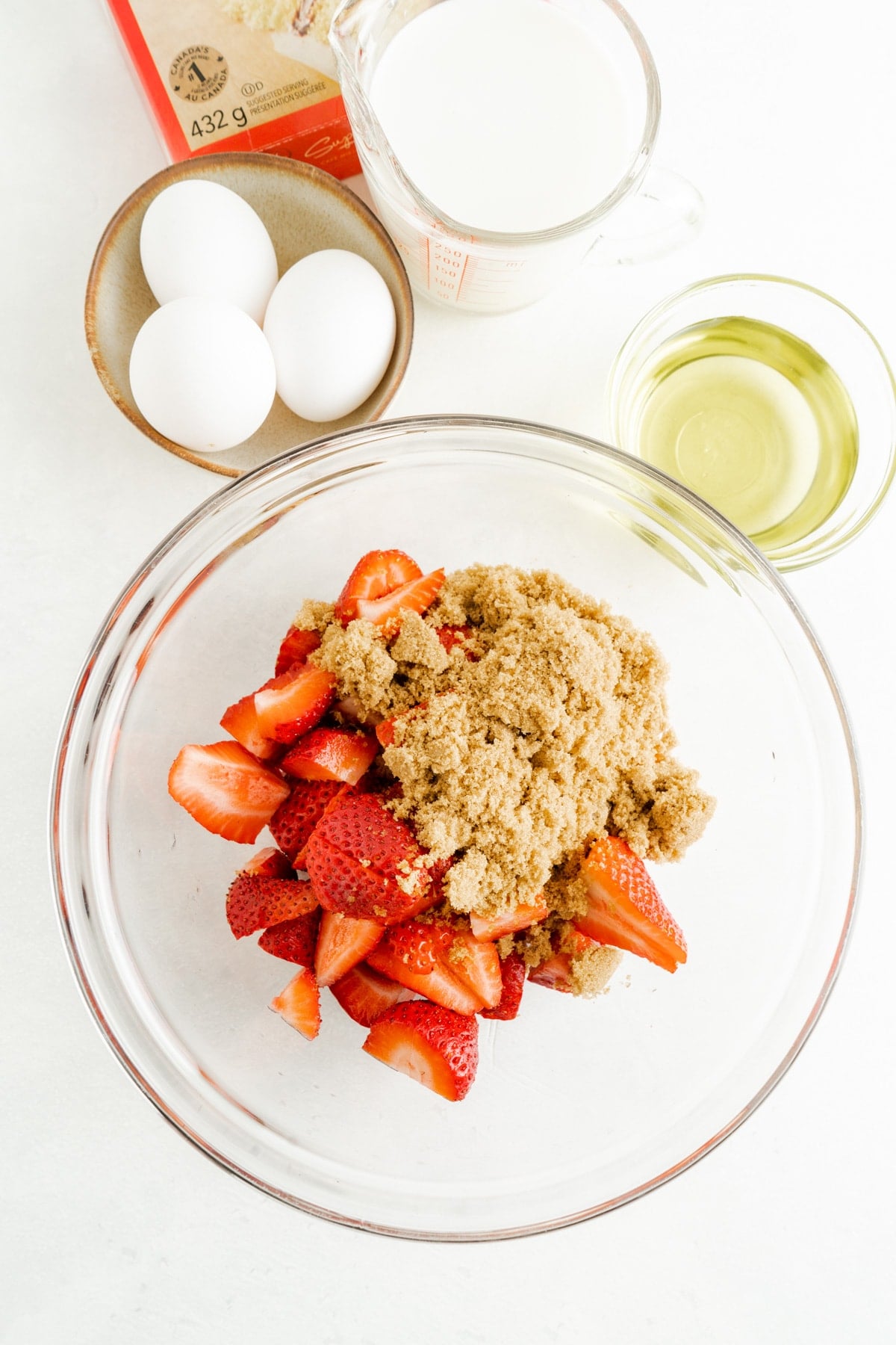 A bowl of strawberries and brown sugar
