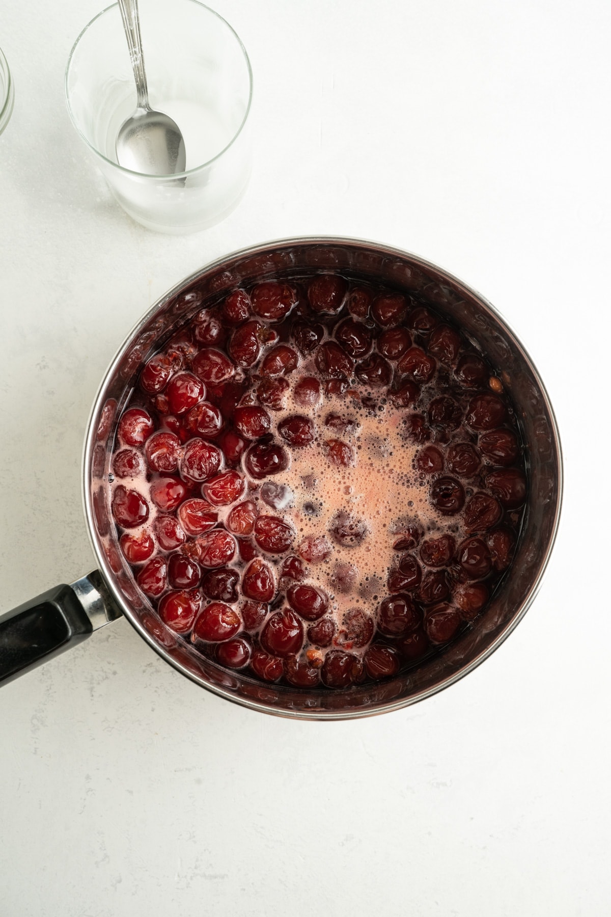 Cherries simmering in a saucepan