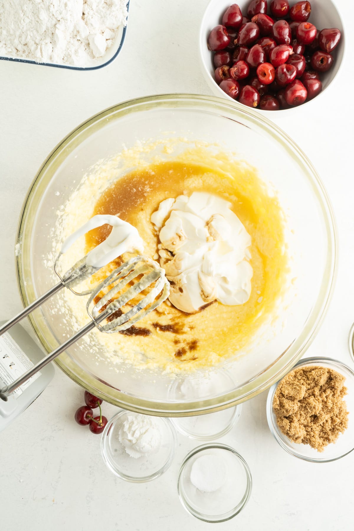 This Cherry Coffee Cake features light, tender layers of cake, a sweet cinnamon swirl, fresh cherries, and an irresistible crumb topping. Eggs, butter, and sugar blended with sour cream and vanilla