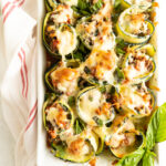 Overhead view of zucchini involtini in a casserole dish