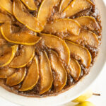 Pear upside down cake on a cake platter