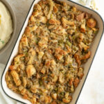 Mushroom and Herb Bread Stuffing fresh out of the oven in a casserole dish.