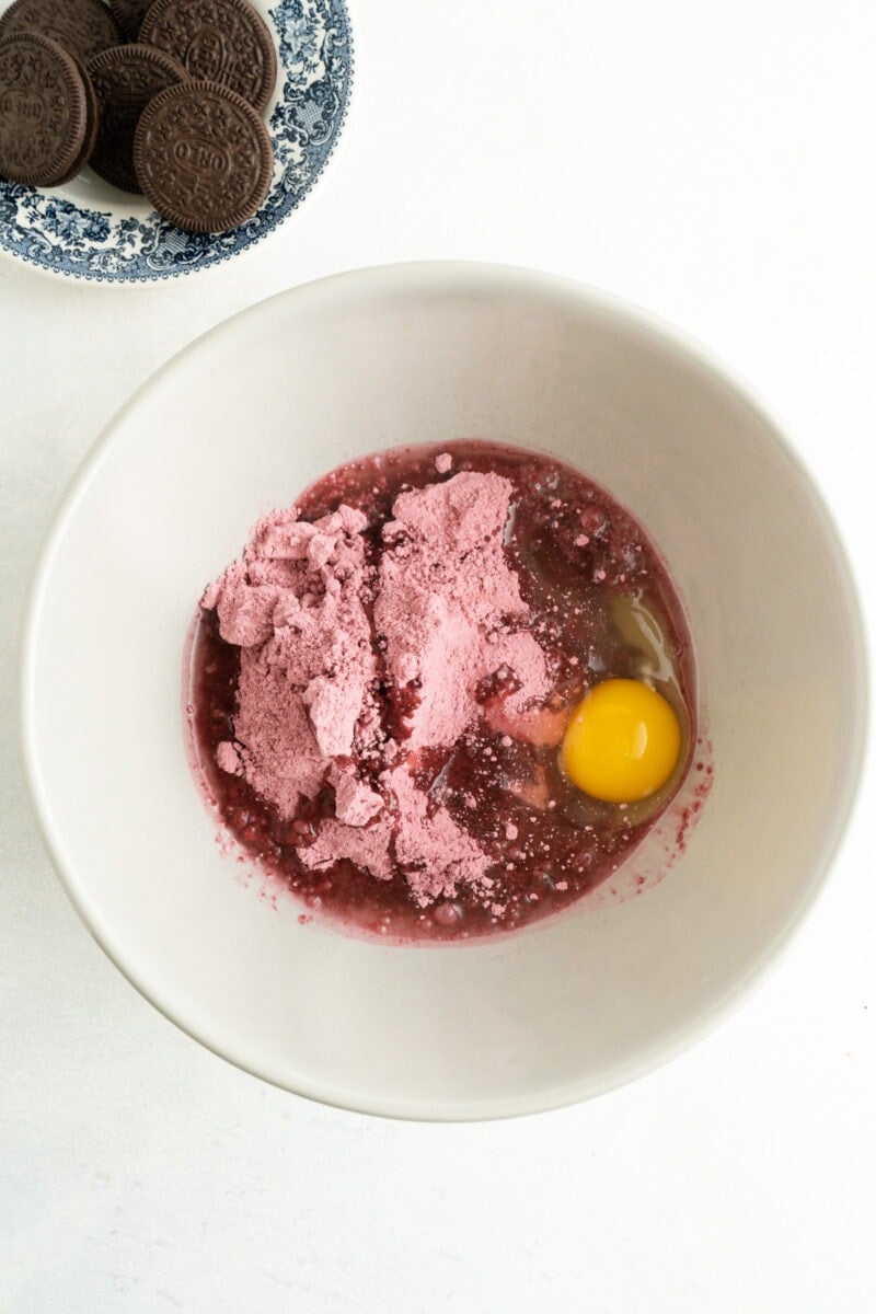 Ingredients for Red velvet cake mix cookie recipe in a bowl.