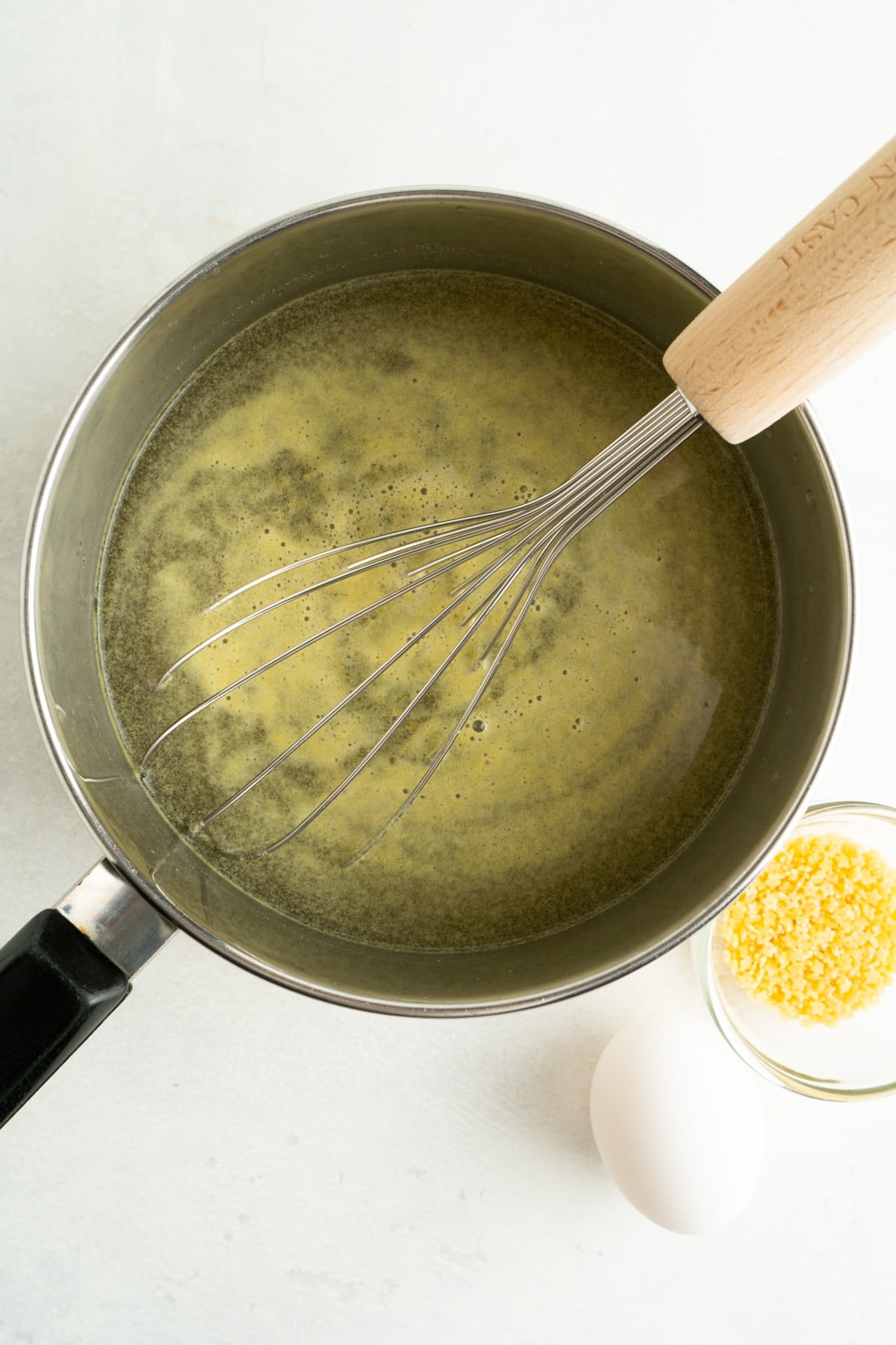 Made with just 4 ingredients in less than 10 minutes, this Pastina Soup with Egg is a classic Italian recipe the entire family will love. Chicken bouillon being whisked into a large pot for a pastina and egg soup.