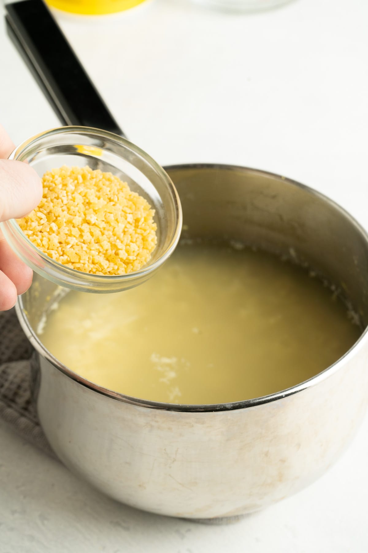 Made with just 4 ingredients in less than 10 minutes, this Pastina Soup with Egg is a classic Italian recipe the entire family will love. A pot of pastina soup in brodo with the pastina being added.