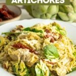 Pinterest pin of orzo pasta salad recipe with pesto and artichokes.