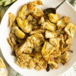 A bowl of crispy artichoke hearts on a tea towel.