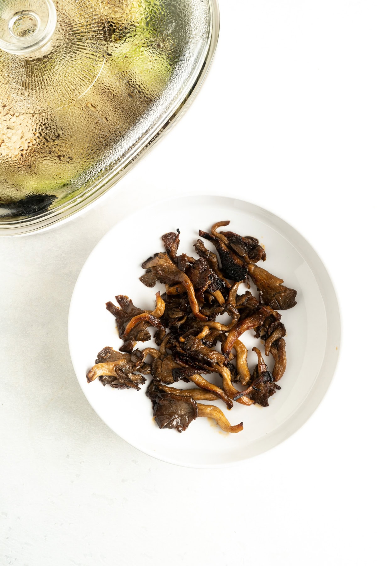 Cooked oyster mushrooms on a plate.