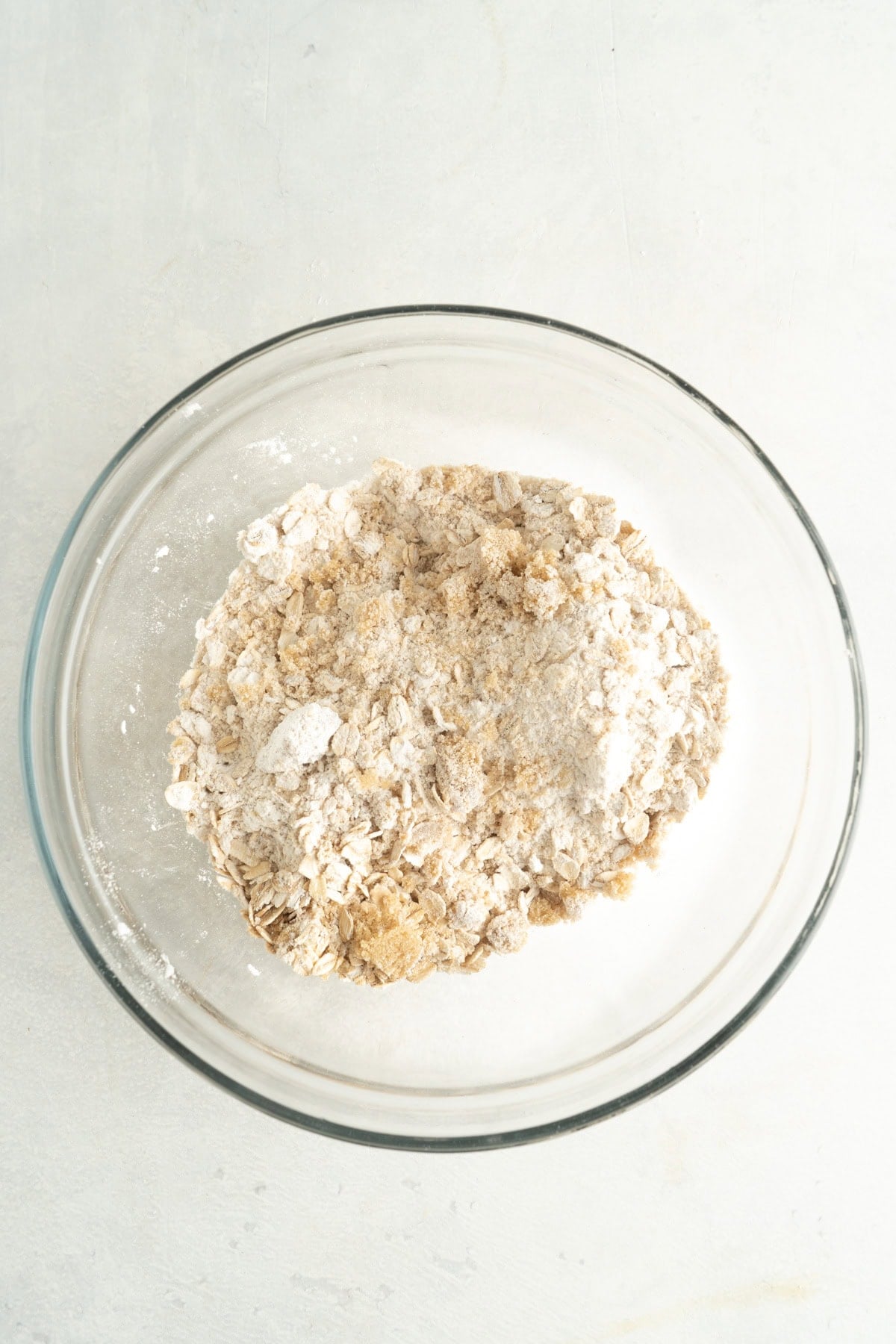 Oats, flour, sugar and spices in a bowl.