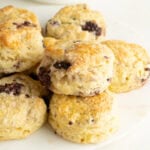 Recipe for blackberry scones made on a plate.