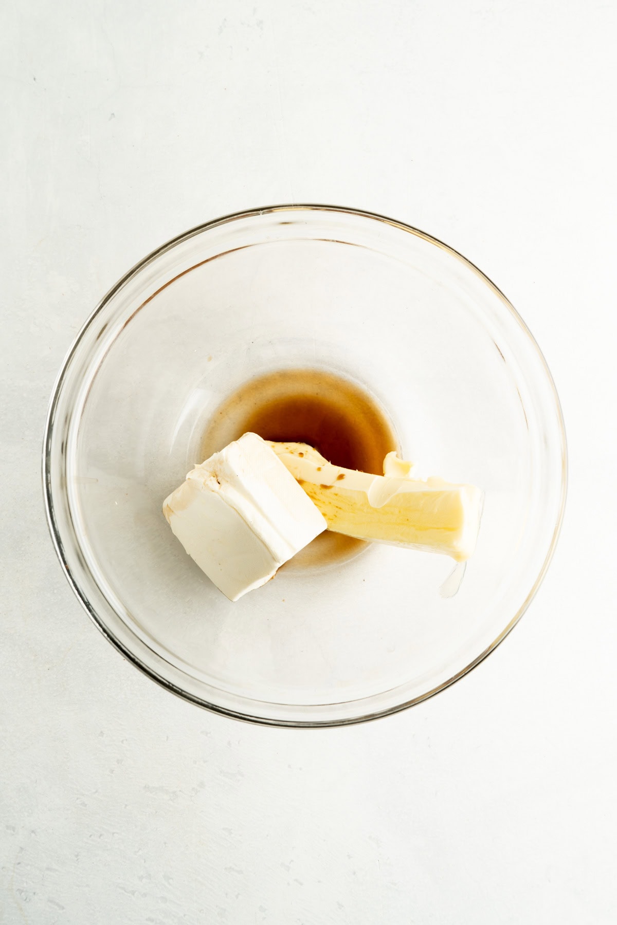 Cream cheese, butter and vanilla in a bowl.
