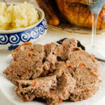 A plate of stuffing made with ground beef on a plate.