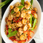 Overhead of a shrimp lo Mein recipe on a table.