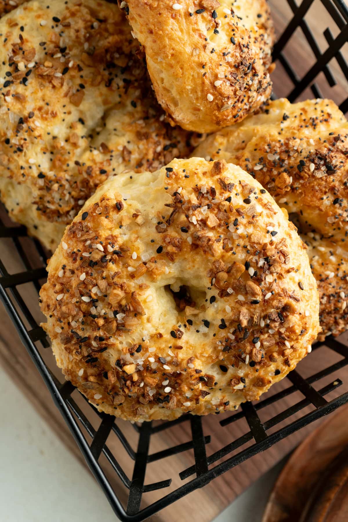 A close up of an everything cottage cheese bagel.