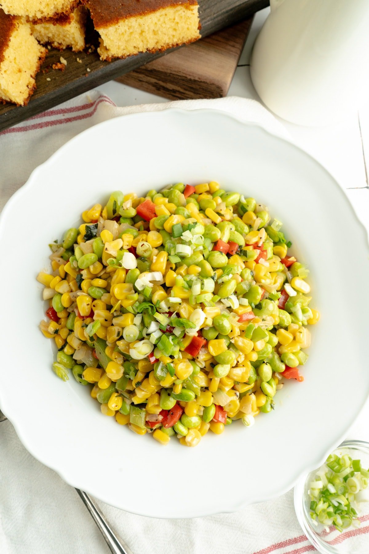 A Corn Succotash Recipe in a white bowl.