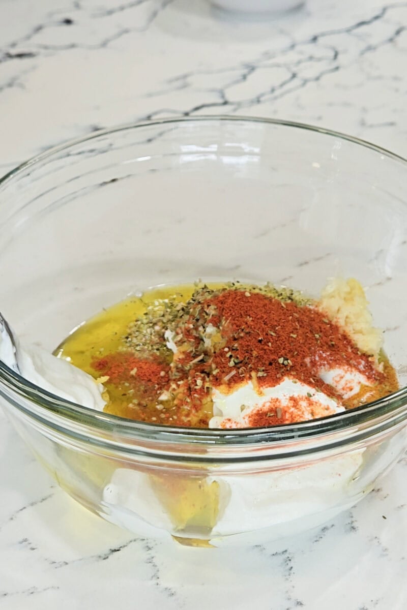 Ingredients in a bowl for a Greek yogurt marinade.