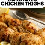 Pinterest pin showing a platter of marinated Greek yogurt chicken.