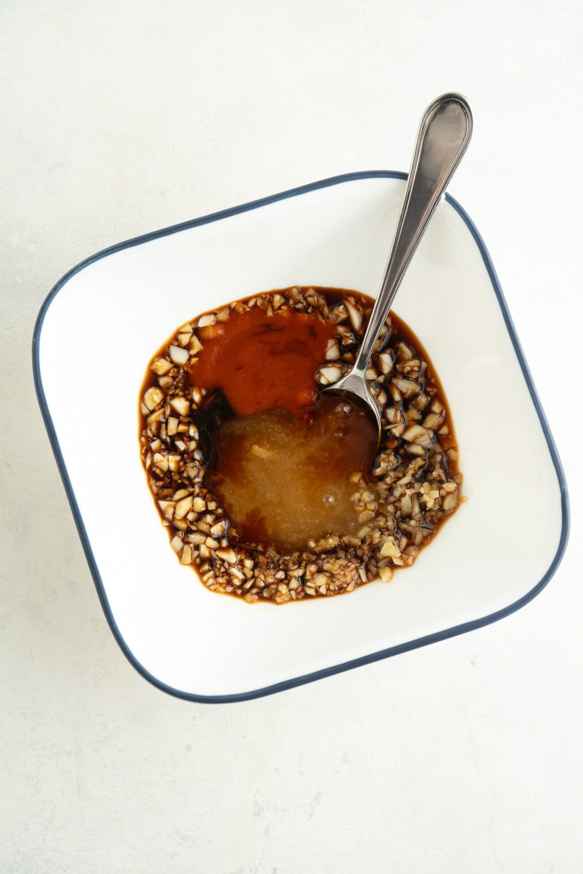 A bowl of ingredients for a sriracha sauce.