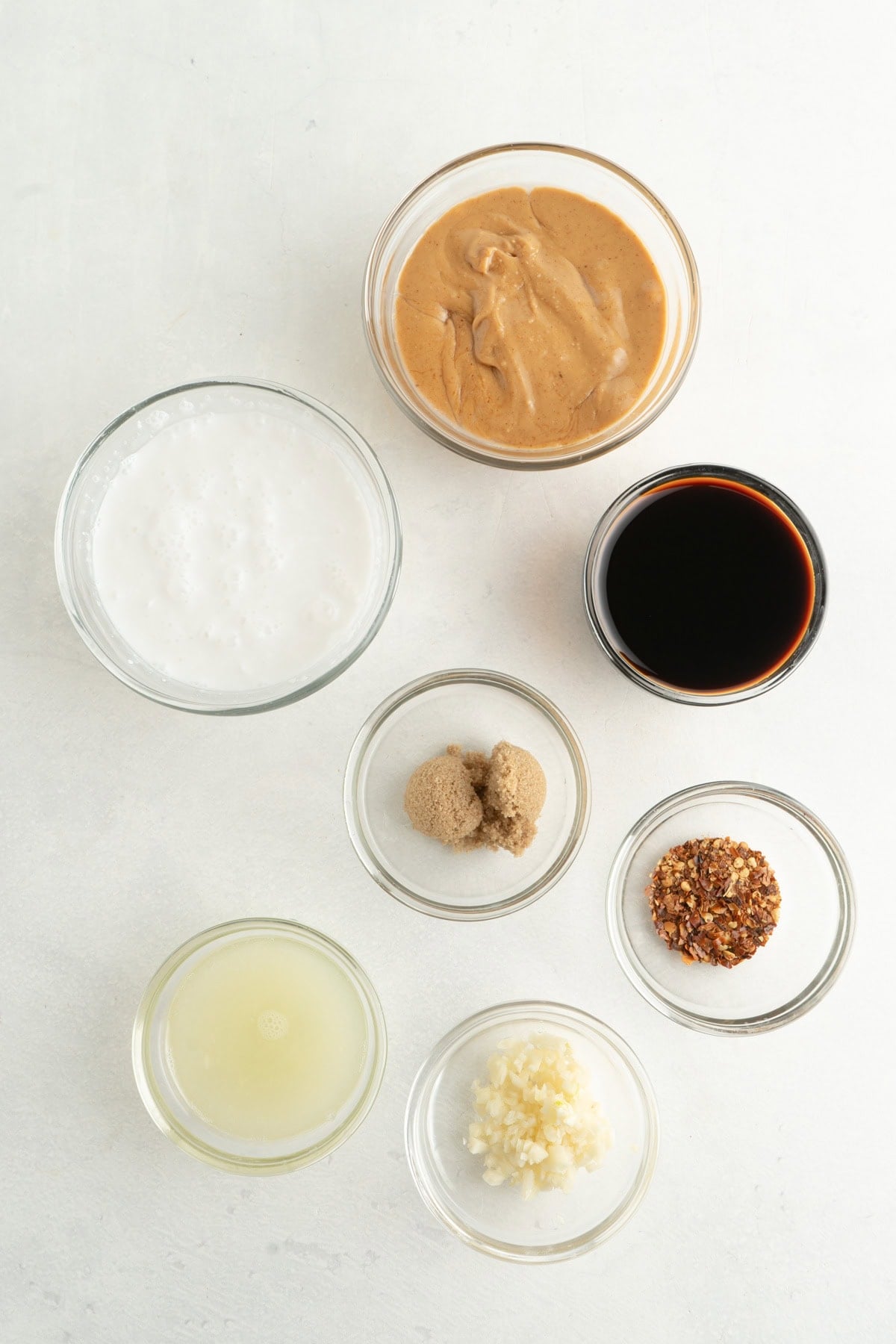 Ingredients for a peanut sauce with coconut milk.