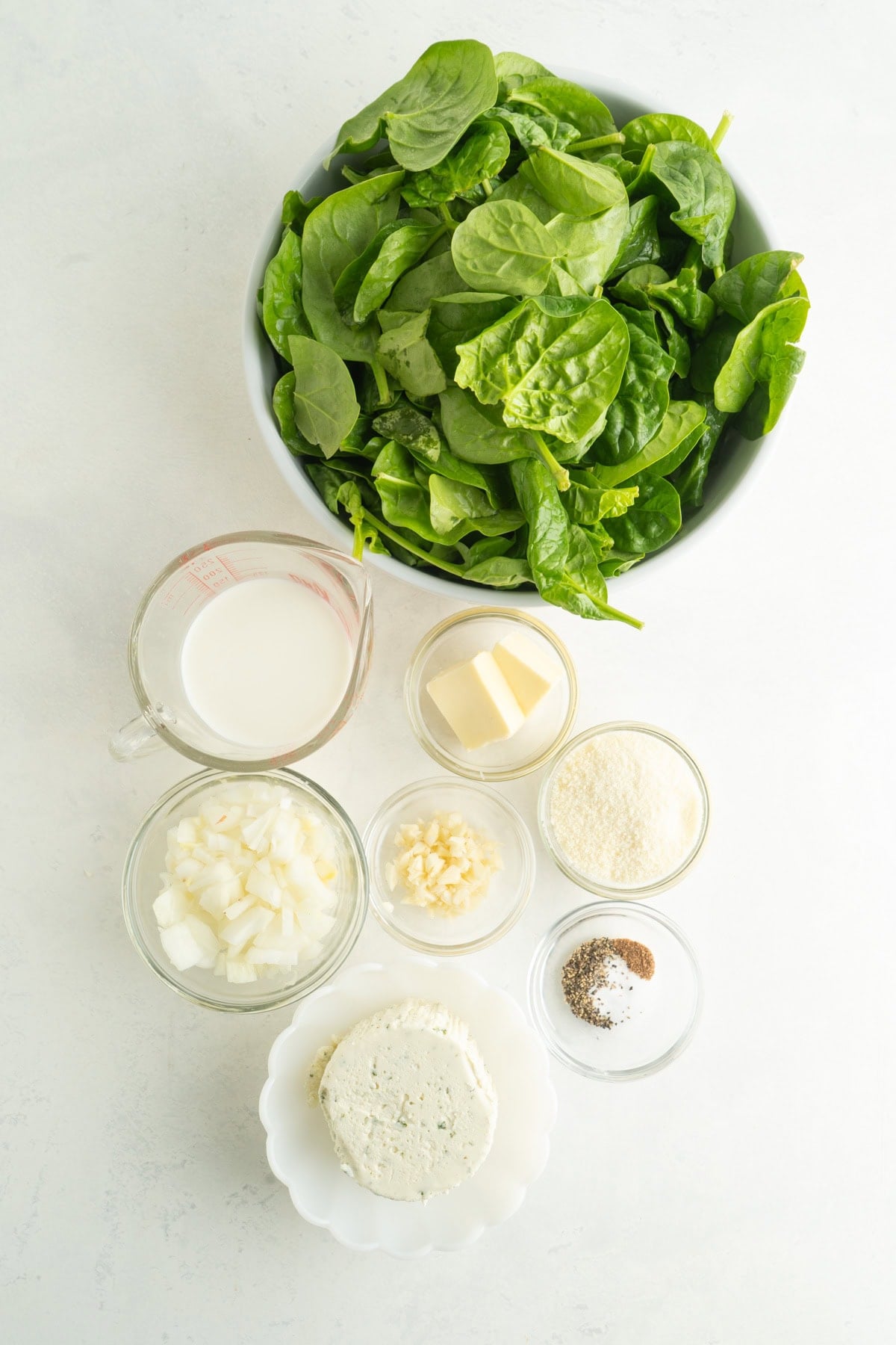 Ingredients for a creamed spinach recipe with boursin.