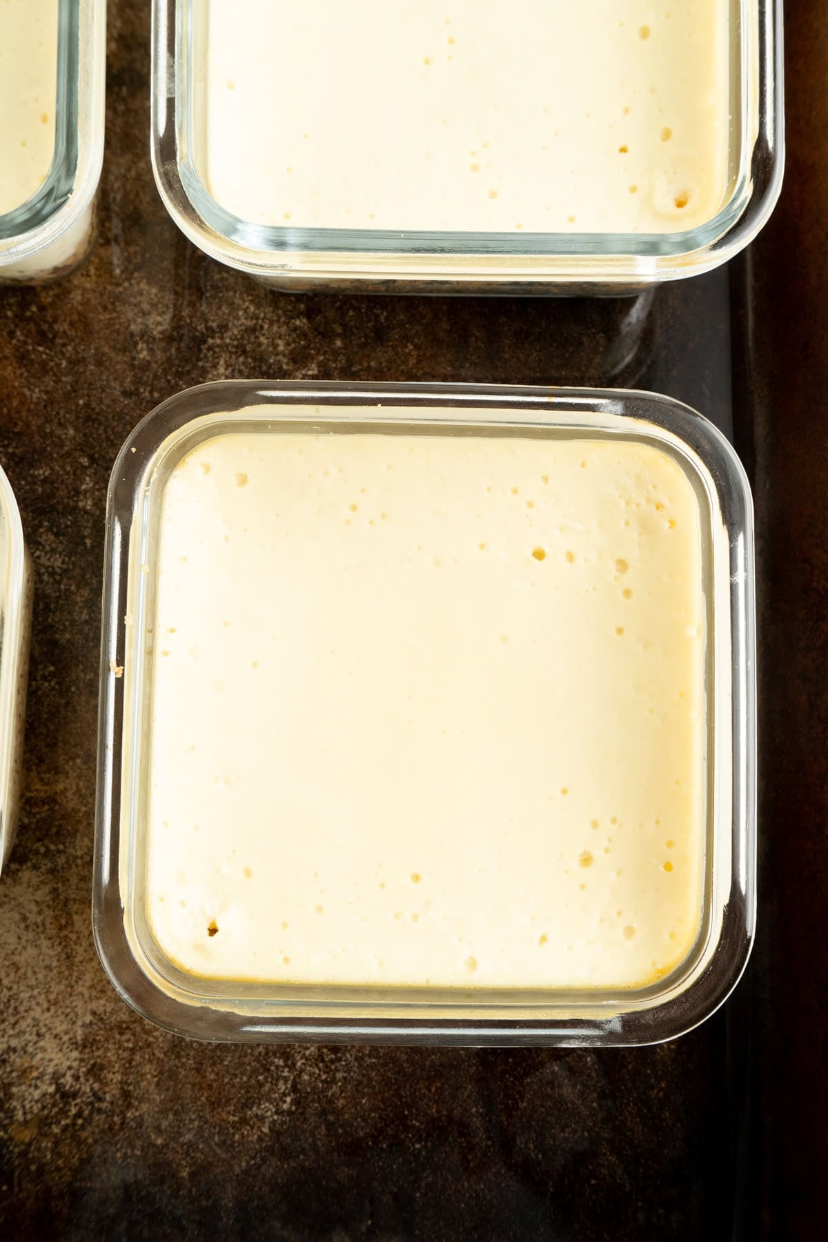 A close up of a baked cheesecake.