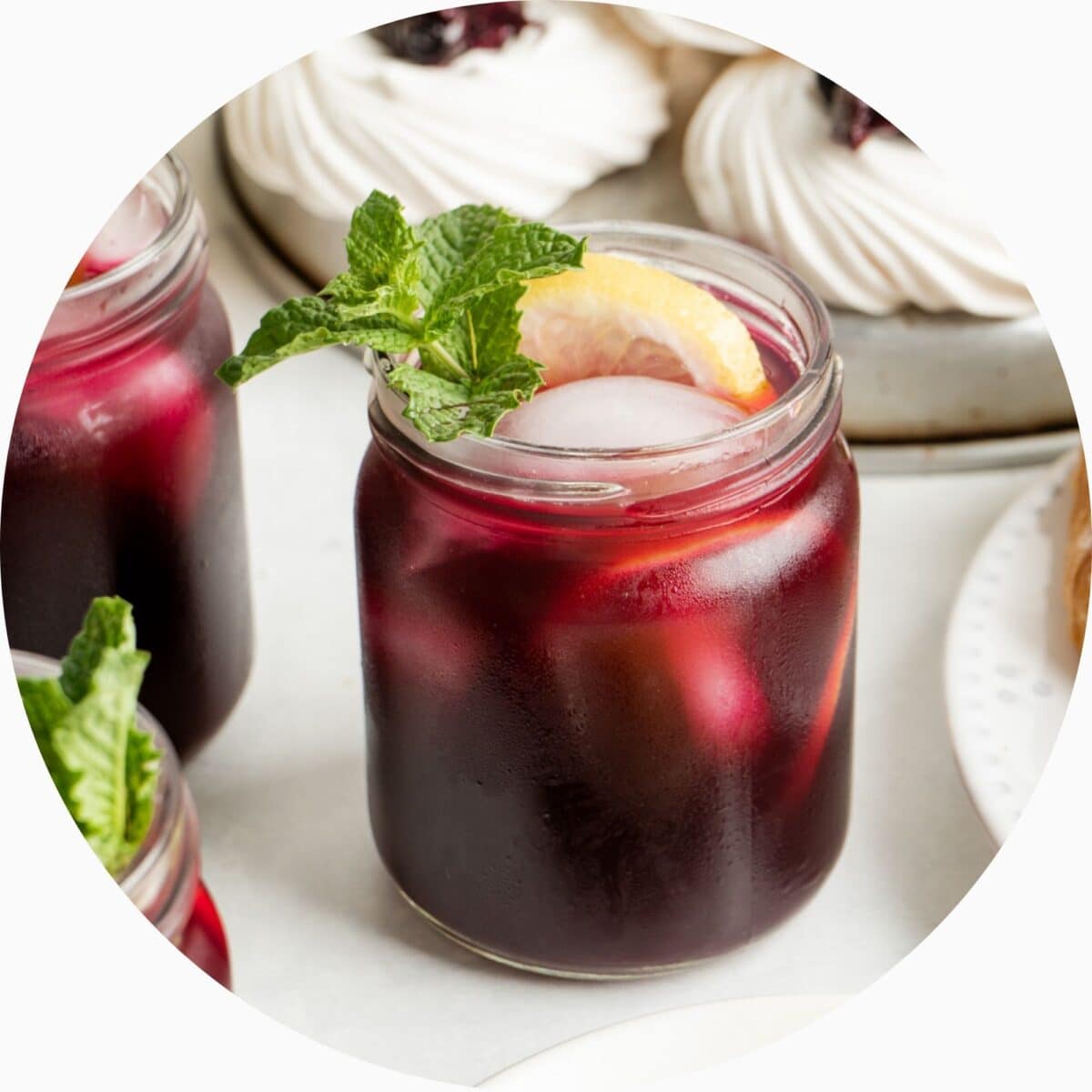 Blueberry iced tea in a circle frame.