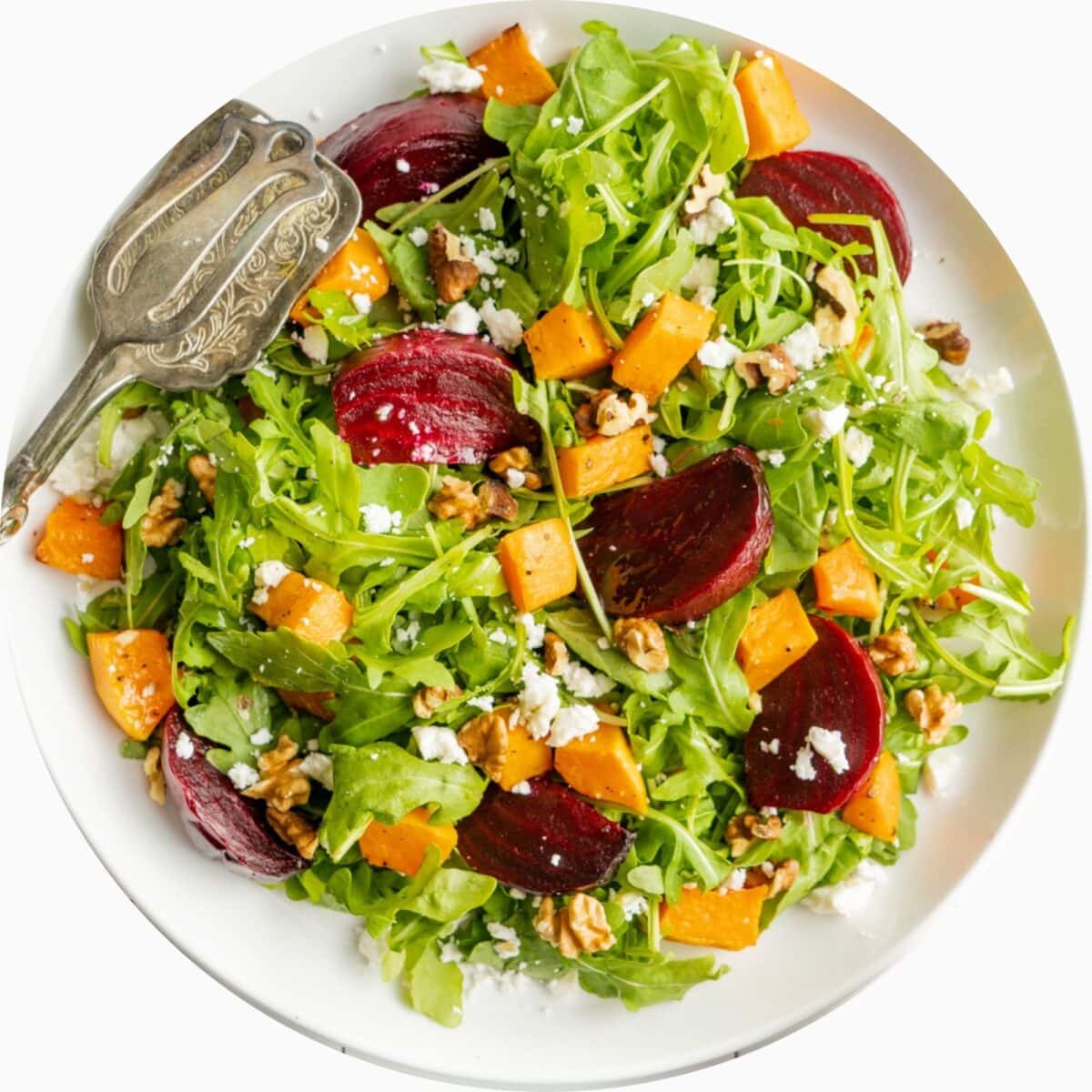 A salad in a circle frame.