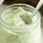 Pinterest Pin Showing a jar of Jalapeno Dressing with a spoon.