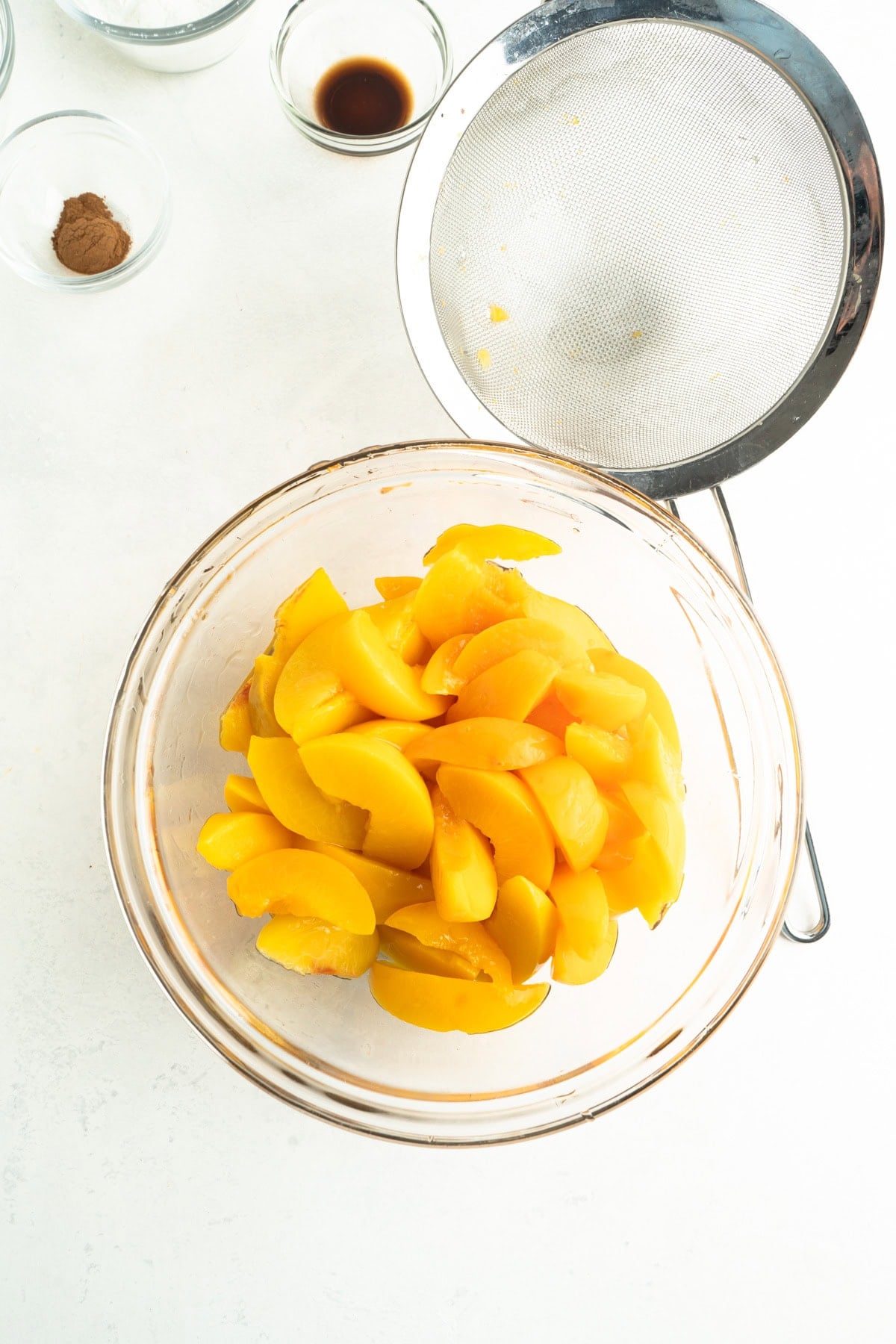 A bowl of strained canned peaches.