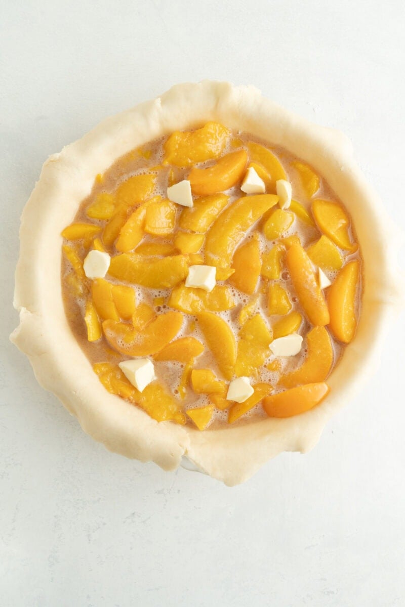 Pie filling dotted with butter.