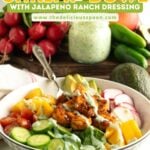 Pinterest pin showing a shrimp and rice bowl with mango on a table.