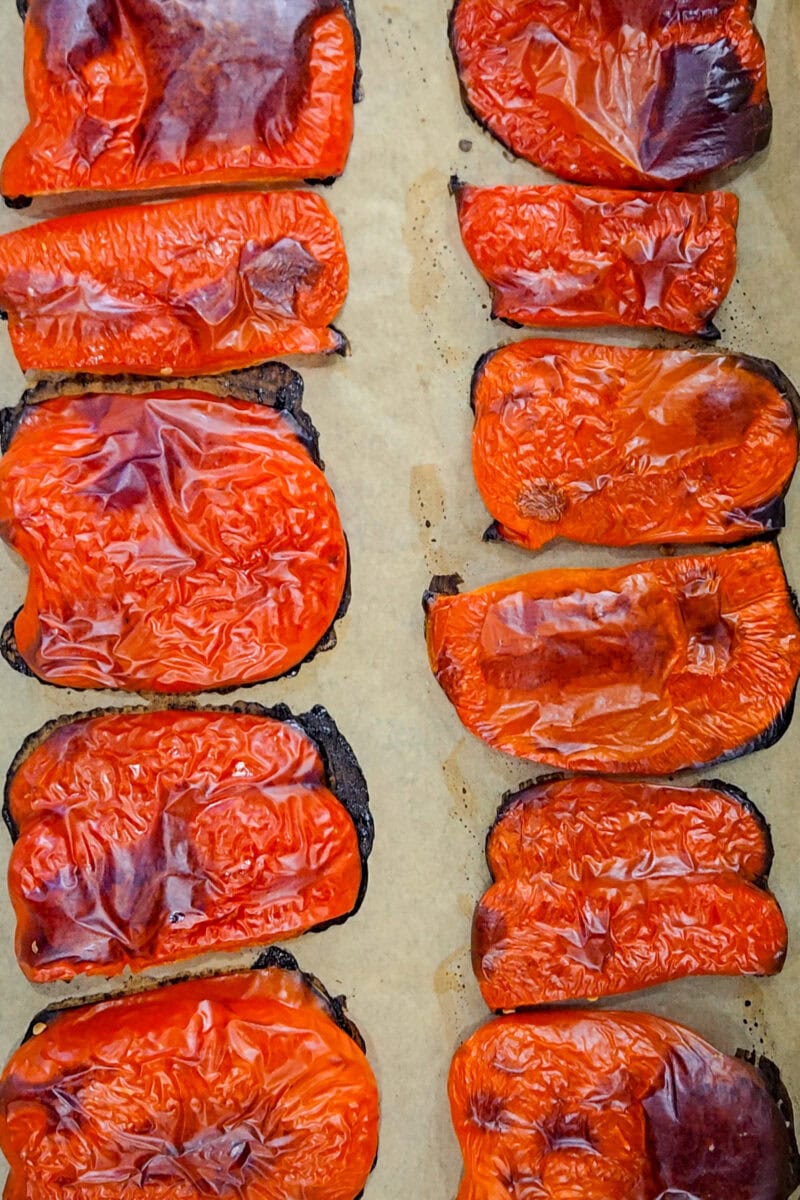 Roasted peppers on a baking sheet.