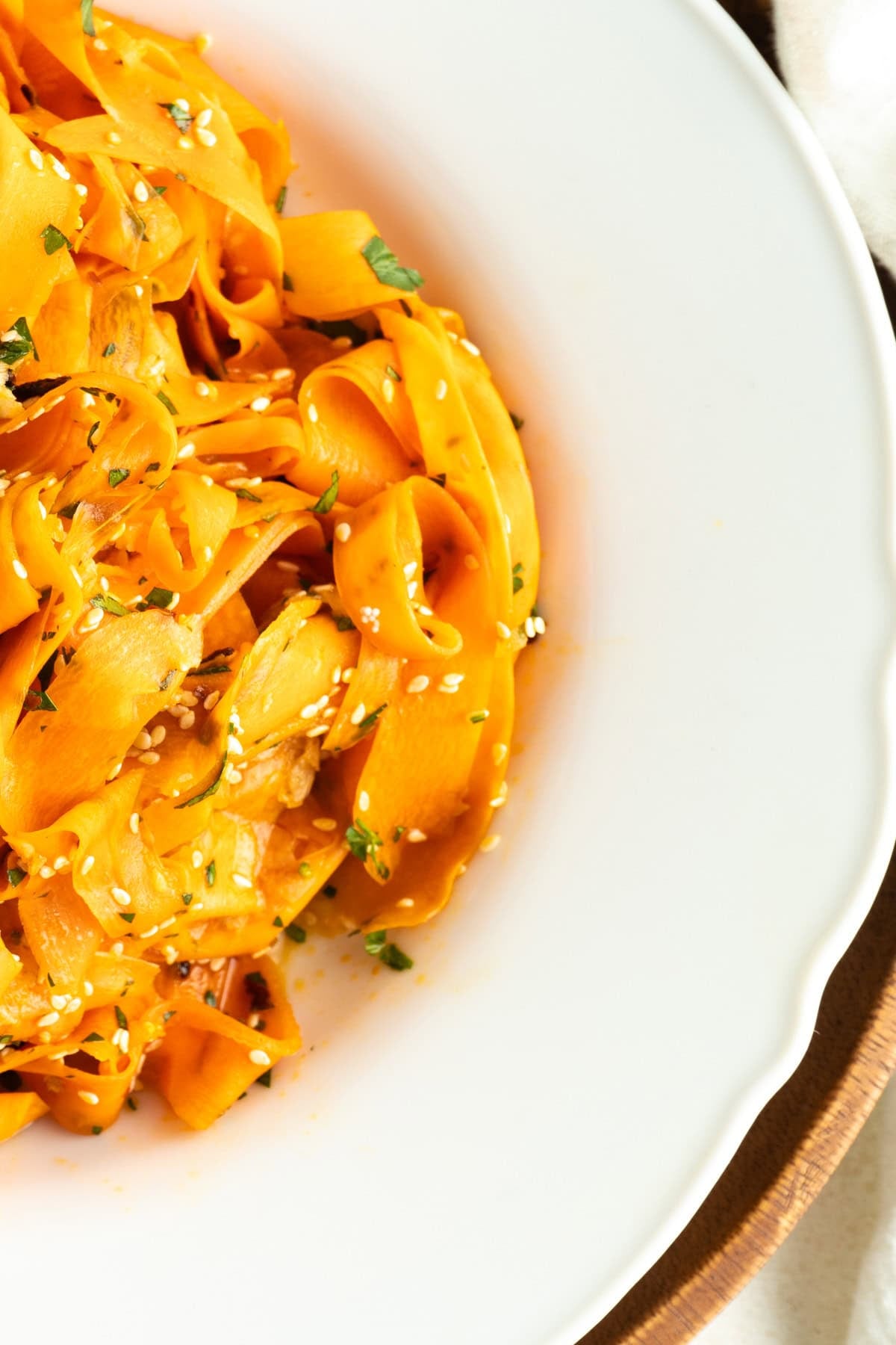 Close up of a bowl of ribbon carrot salad.