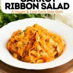 Pinterest pin for a spicy raw carrot salad.