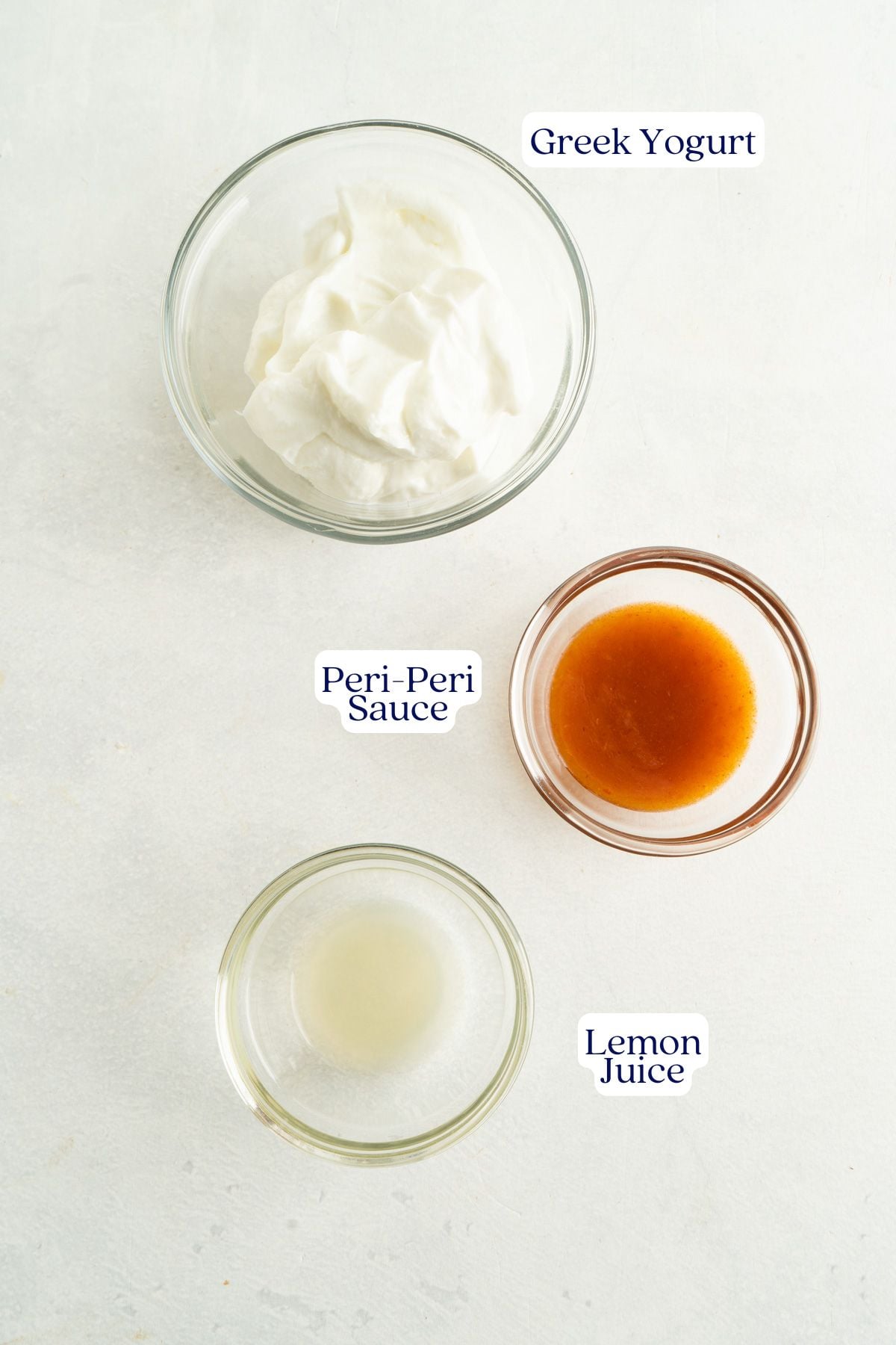 Three ingredients in a peri-peri yogurt sauce.