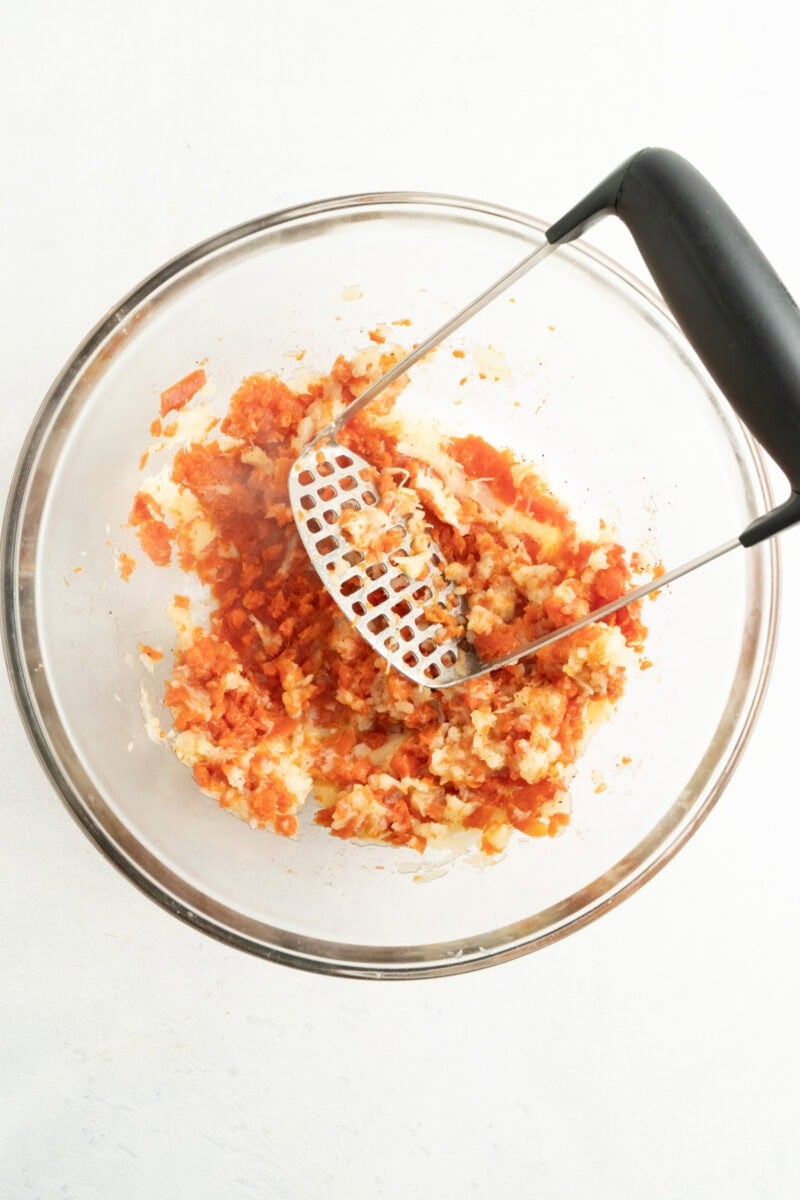 Carrots and parsnips being mashed.