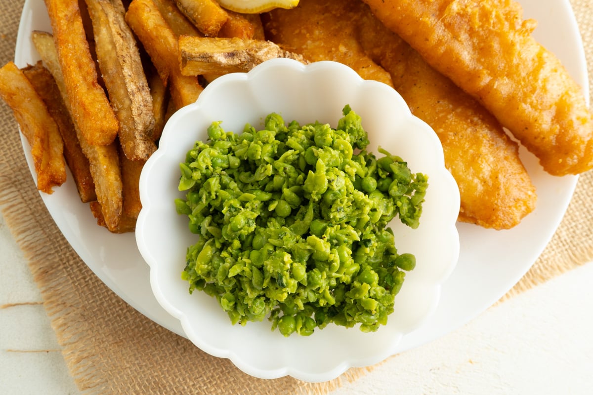 An overhead shot of a bowl of minted mushy peas.