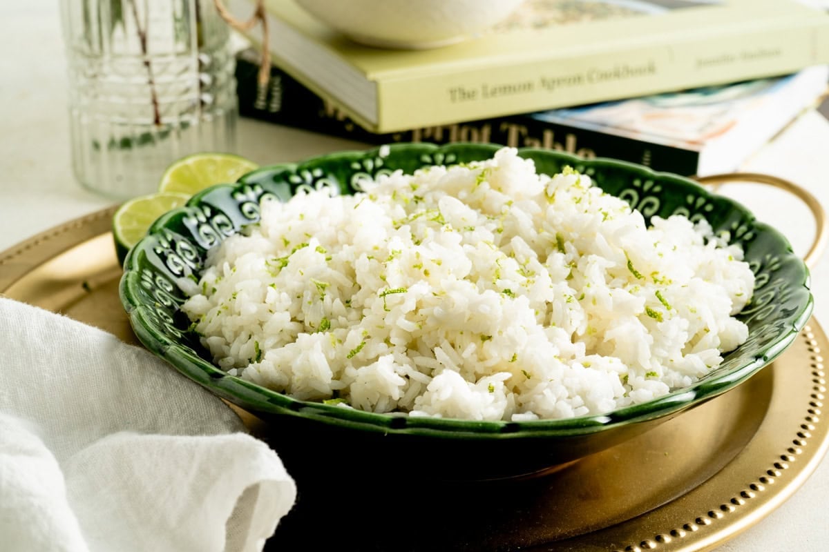 A bowl of jasmine rice on a table setting.