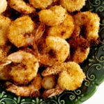 Close up of panko shrimp in a green bowl.