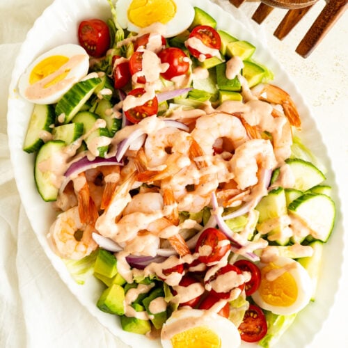 An overhead shot of a Shrimp Louie Salad on a table.