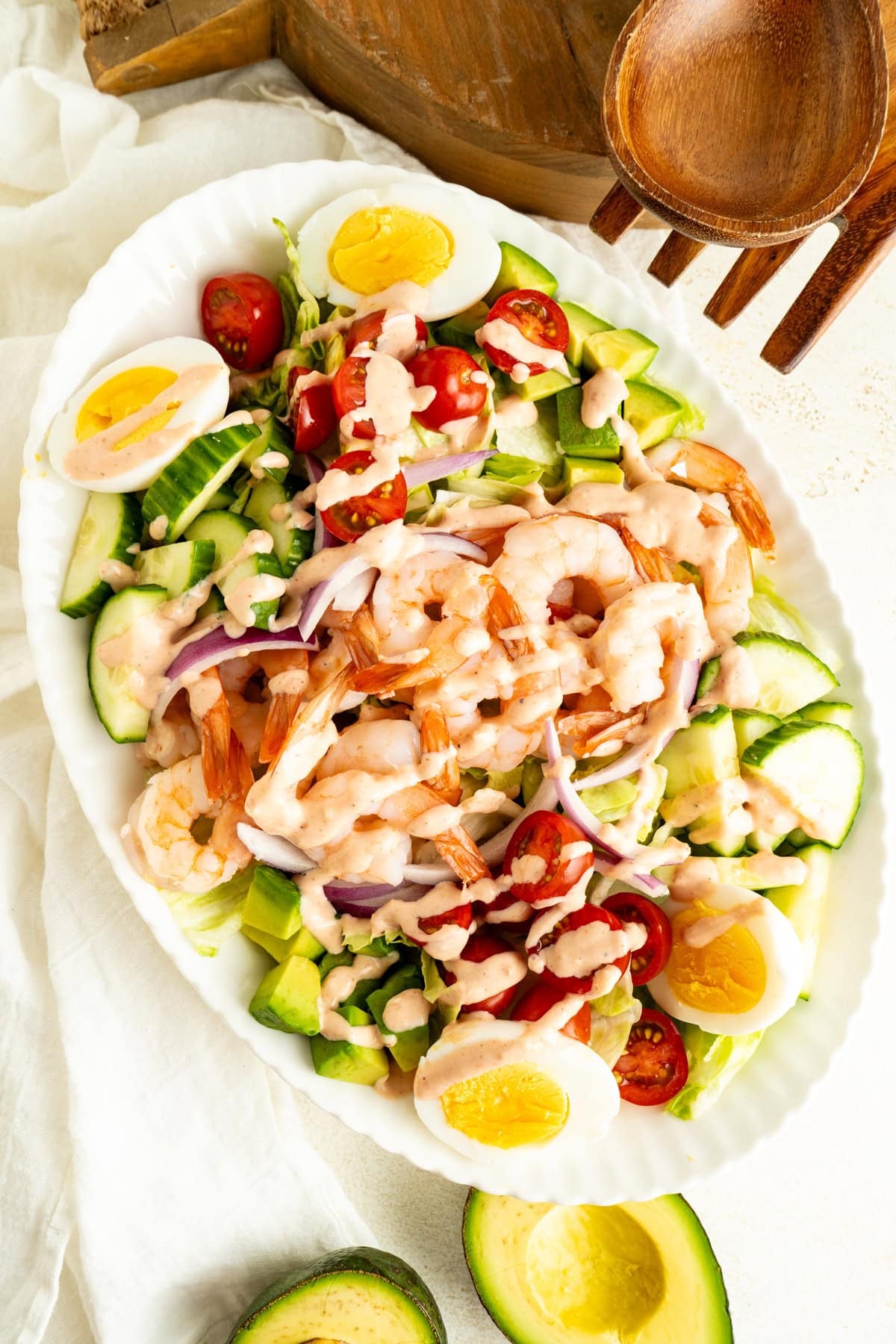 An overhead shot of a Shrimp Louie Salad on a table.