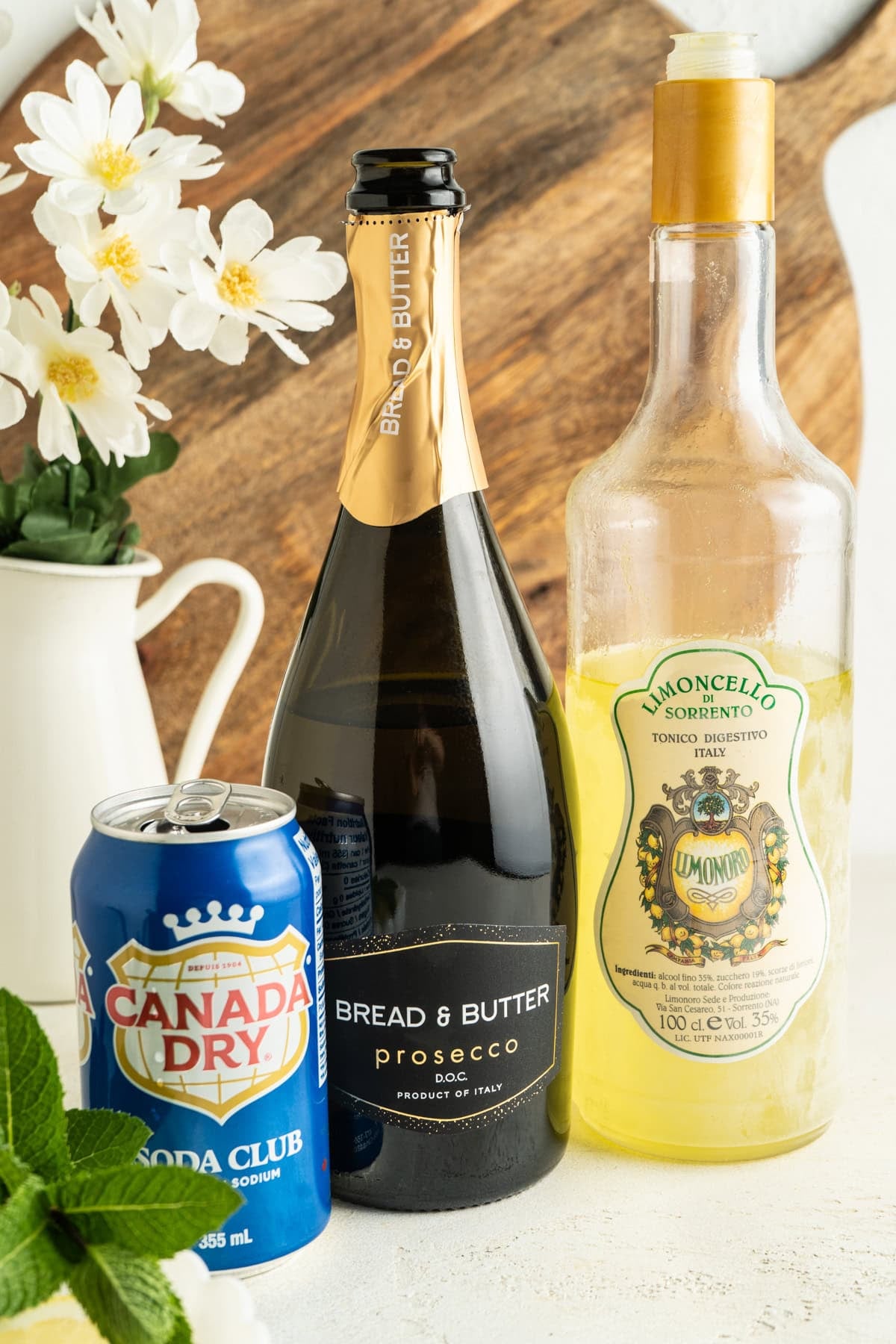Ingredients for a limoncello spritz on a table.