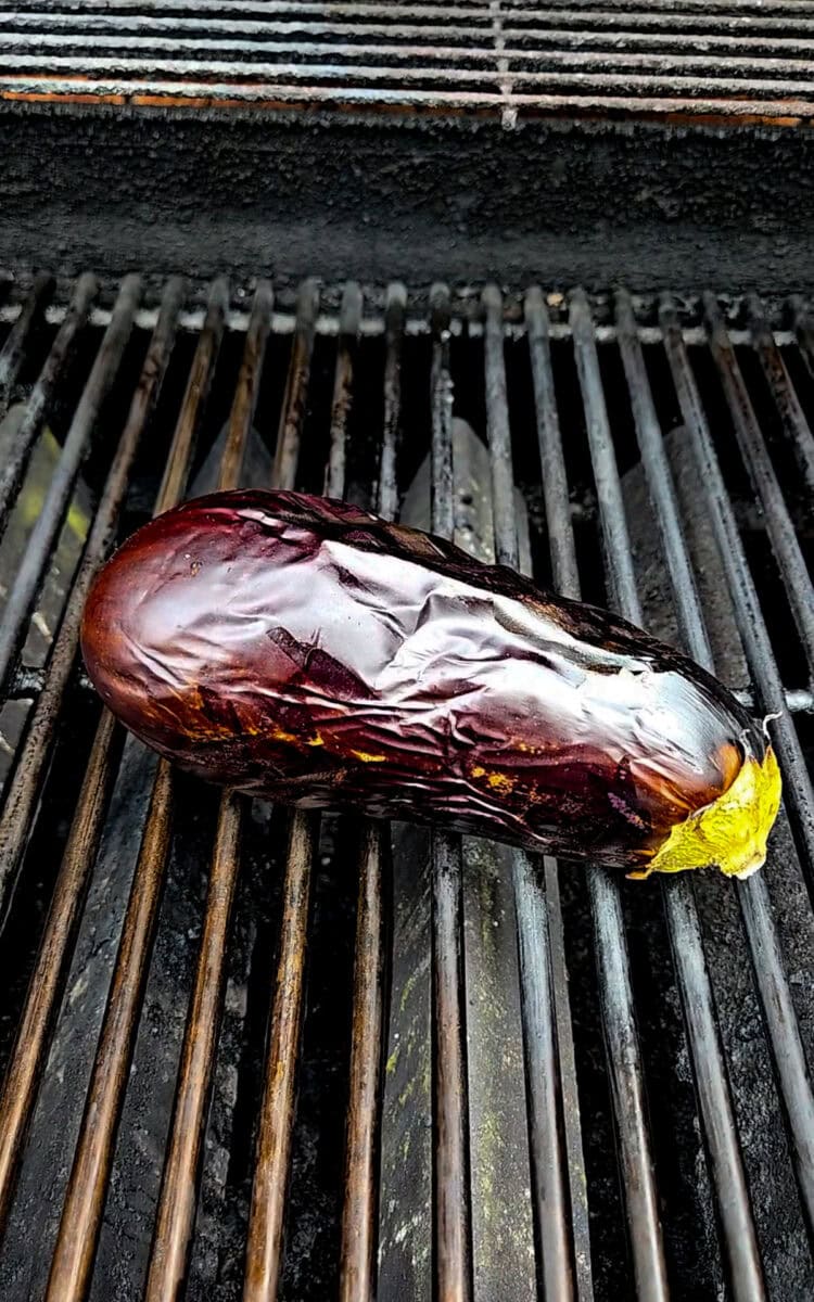 An eggplant on a grill.