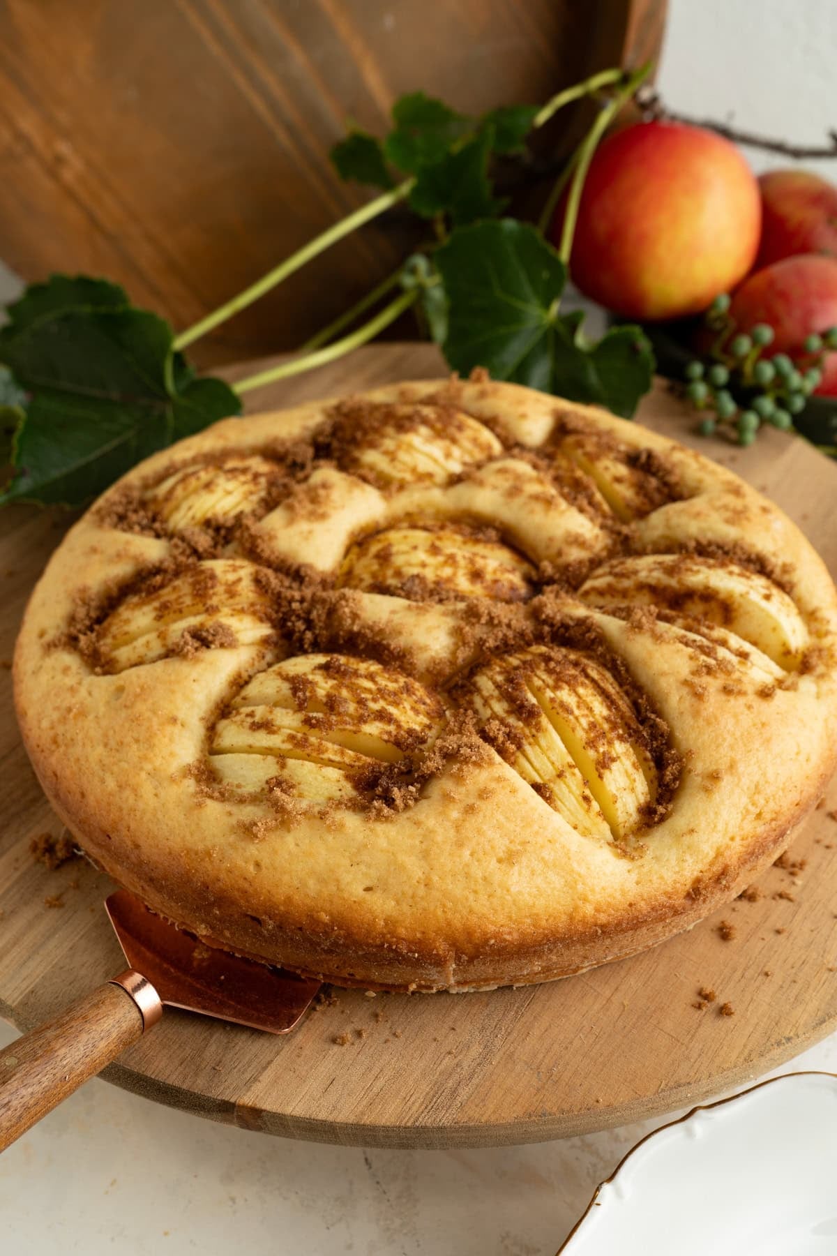 German Apple Cake on a wooden cake plate.